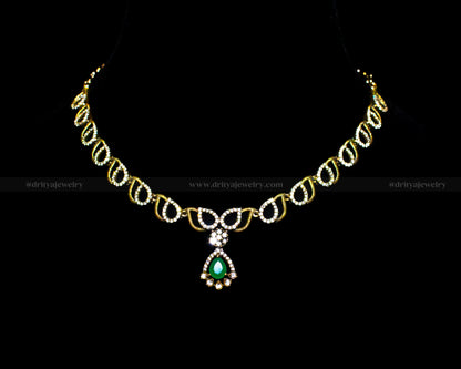 Front view of the Mehndi Victorian Necklace Set by Dritya Jewelry featuring a green gemstone pendant and gold-toned teardrop motifs.