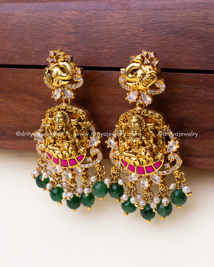 Front view of premium temple dangler earrings featuring goddess carving, elephant stud, and kemp stone detailing.
