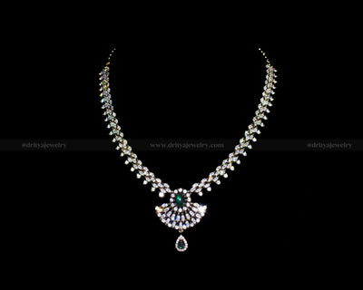 Front view of the Victorian Necklace Set by Dritya Jewelry, adorned with sparkling CZ stones and a green gemstone pendant.