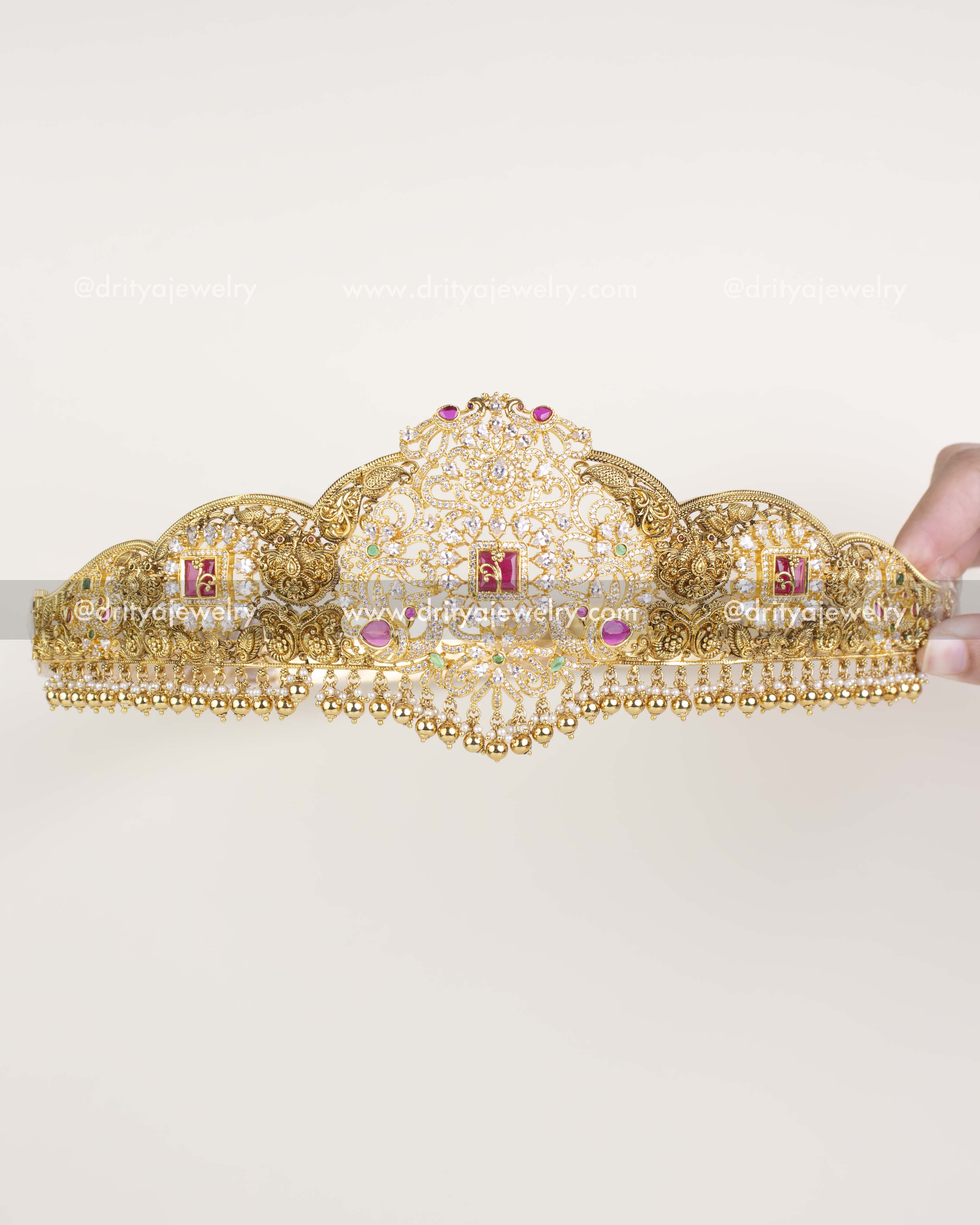 Complete view of ornate bridal waist belt with CZ stones, pearls, and gold-plated detailing.
