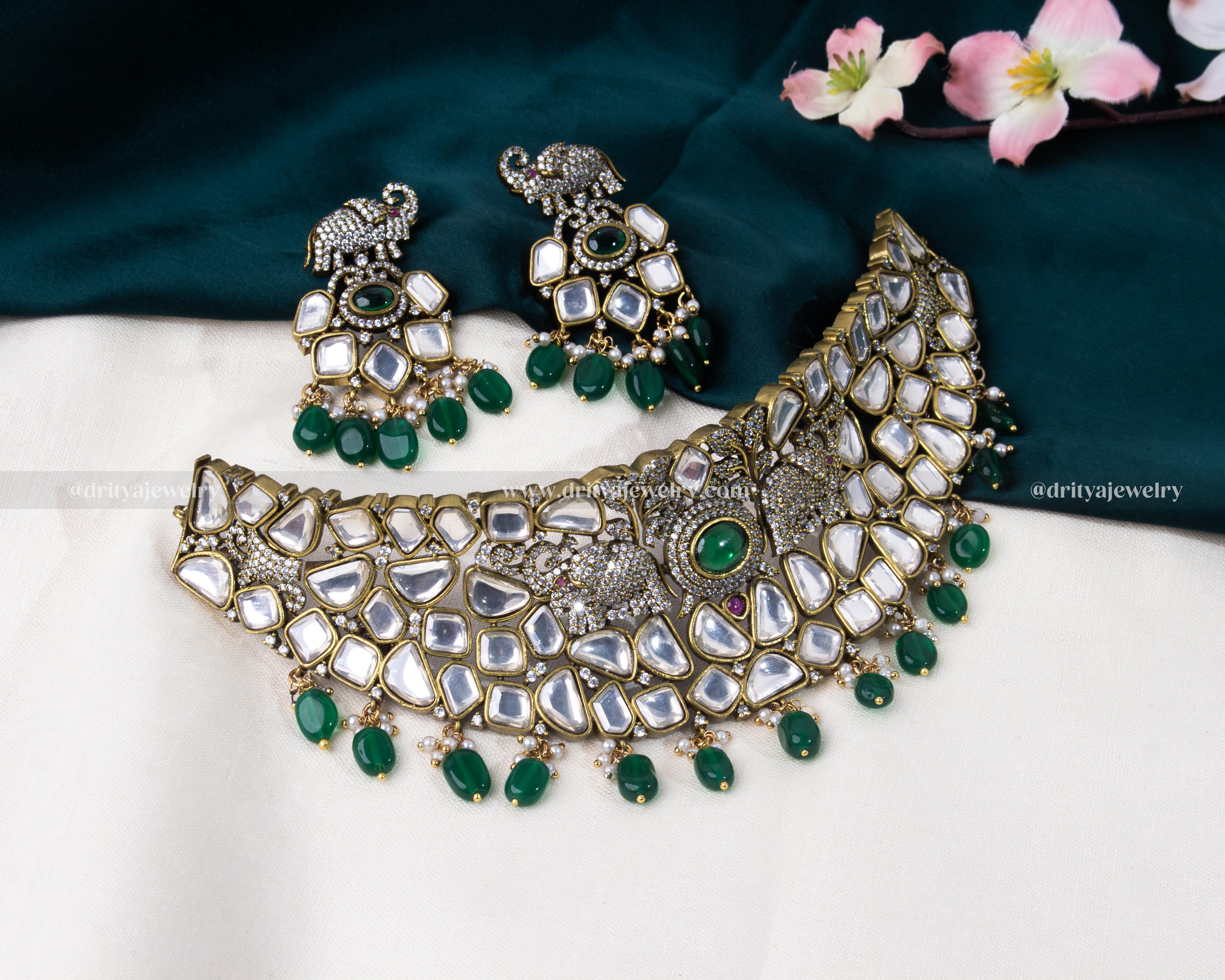 Full view of a Kundan choker set with intricate designs and green bead embellishments by Dritya Jewelry.