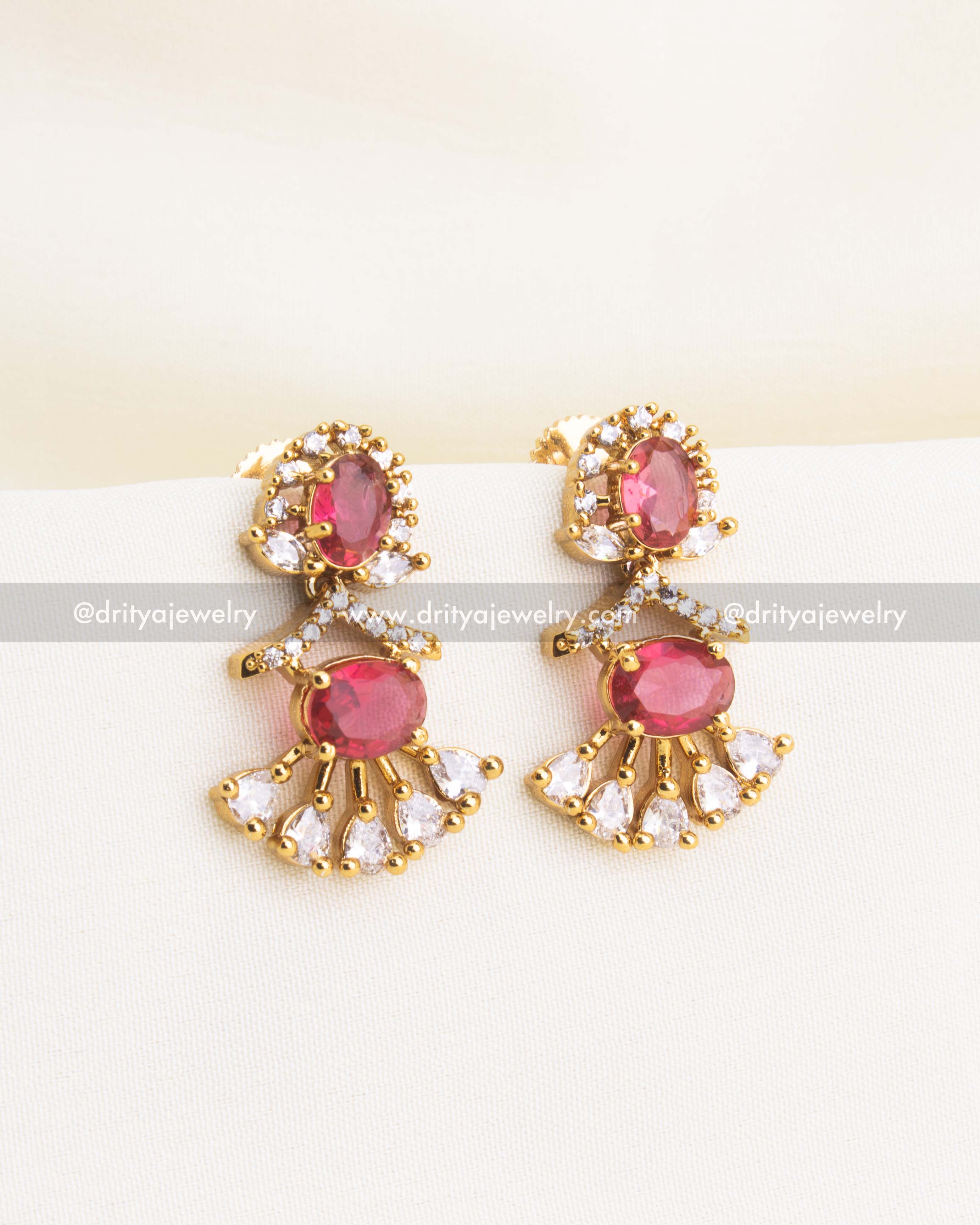 Elegant ruby red CZ short necklace with matching earrings in gold polish finish.