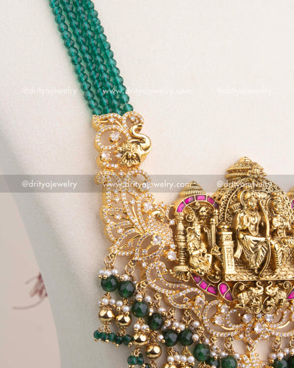 Multi-layer strands of green faceted beads attached to antique gold temple connectors.