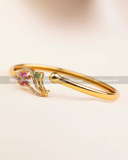 Close-up of locking mechanism and hinge on gold openable adjustable bangle