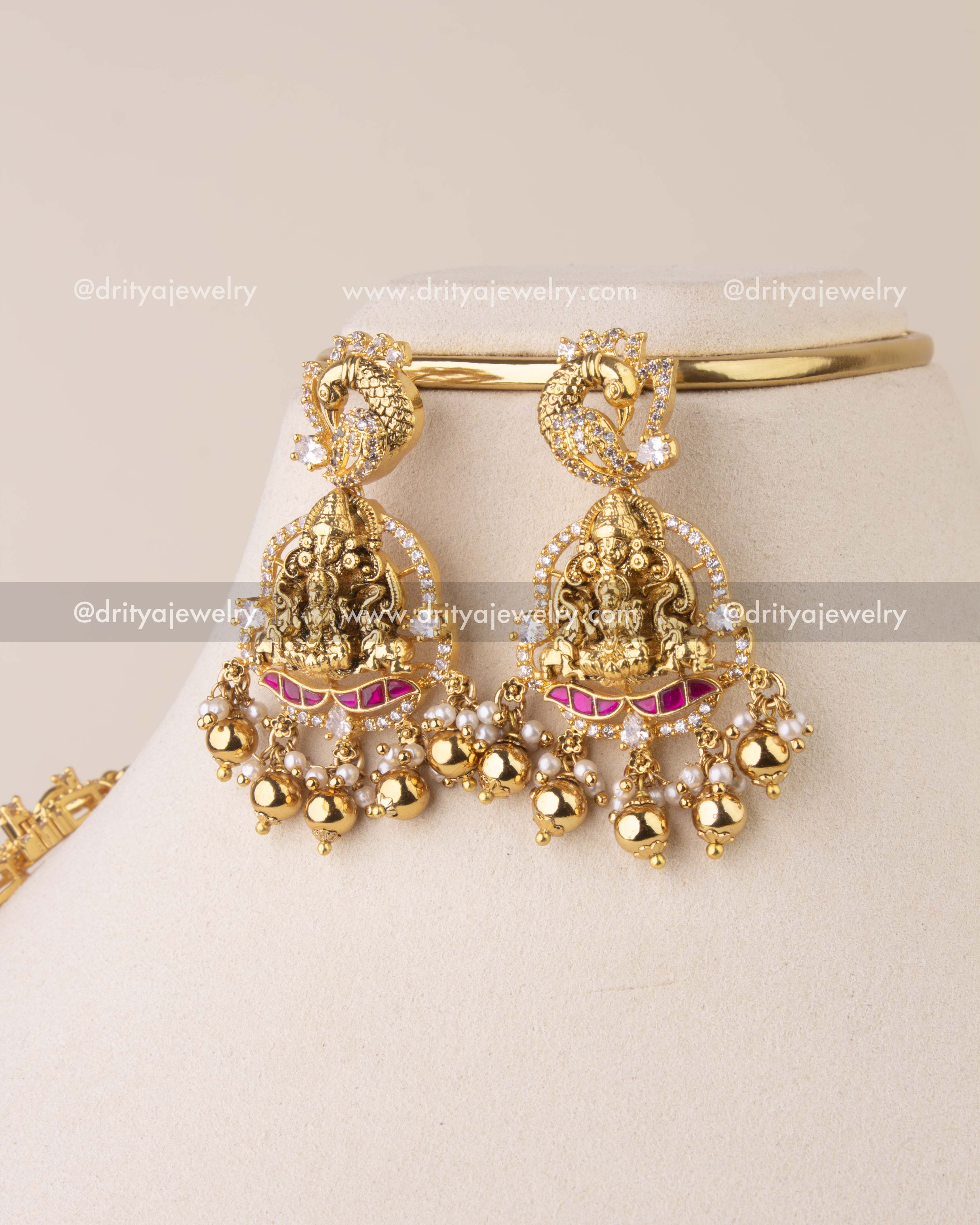 Traditional Kemp earrings featuring Lakshmi motif with CZ stones, Kemp accents, and golden bead drops.