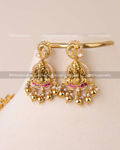 Traditional Kemp earrings featuring Lakshmi motif with CZ stones, Kemp accents, and golden bead drops.
