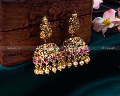 Full display of Dritya Jewelry's Lakshmi Devi Grandeur Choker Set with intricate carvings and gemstone embellishments.