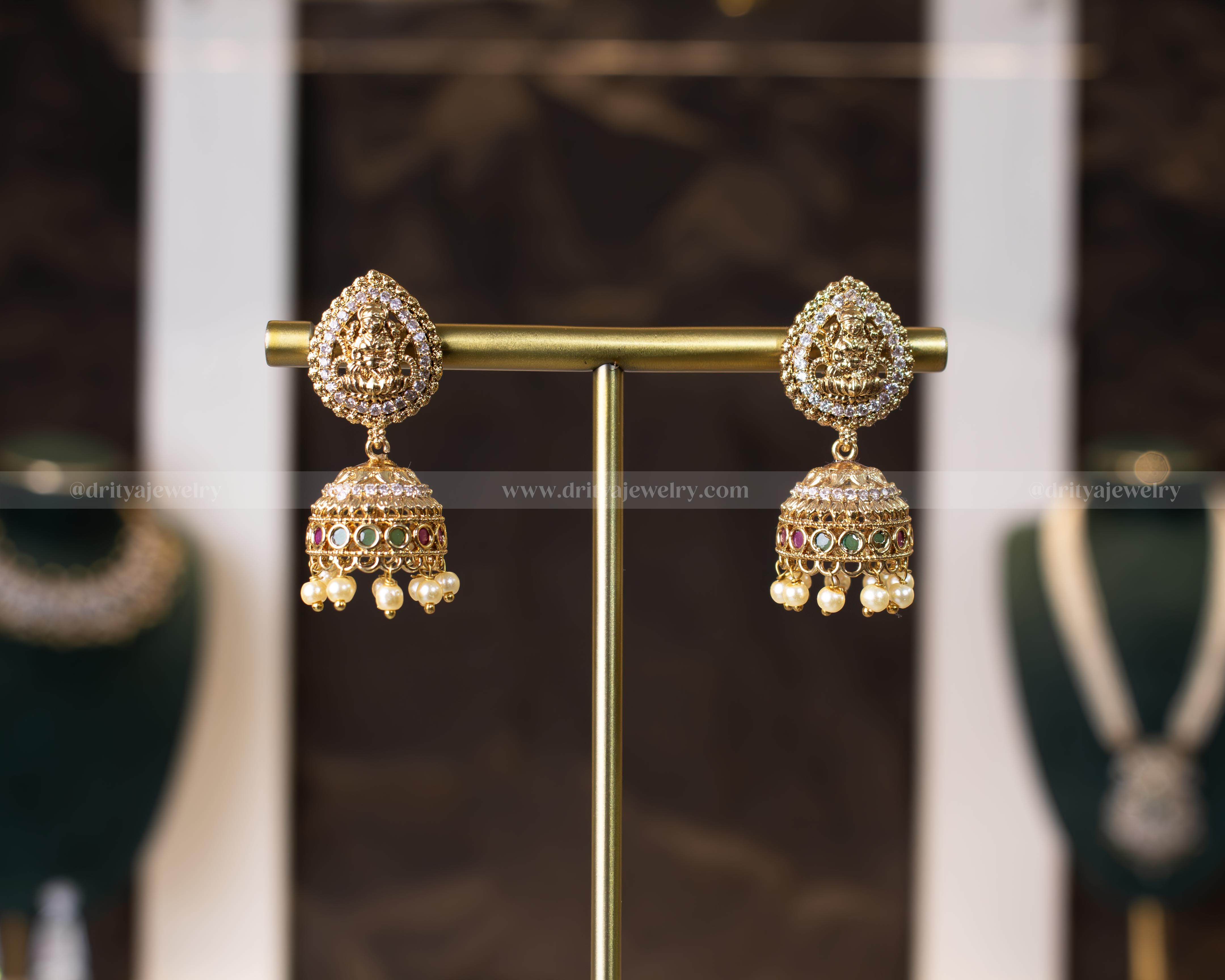 Exquisite Lakshmi Devi Temple Jhumkas featuring Goddess Lakshmi motif, adorned with imitation rubies, emeralds, and pearls by Dritya Jewelry.