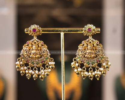 Matching chandbali-style earrings of Dritya Jewelry’s Lakshmi Temple Necklace Set with intricate temple motifs, pearls, and gold-plated design.