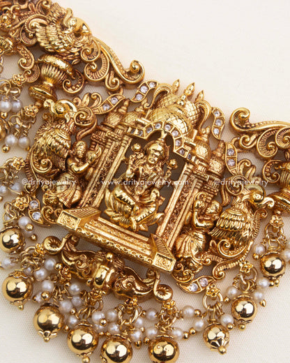 Central Lakshmi pendant framed by temple pillars, peacocks, dancers, and pearl-ghungroo drops.
