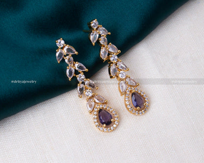 Elegant gold-tone necklace set with purple stones and sparkling CZ, ideal for special occasions.