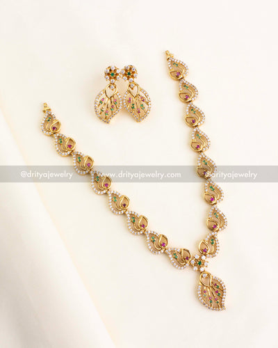 CZ-studded gold-tone necklace set with pink and green stone accents