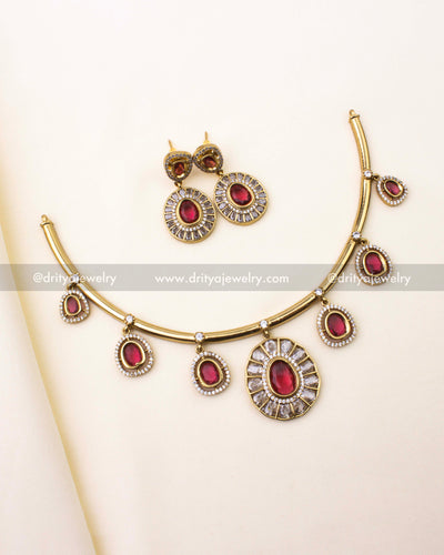 Full view of red Hasli necklace set with earrings on ivory background