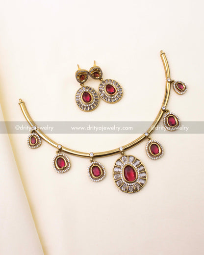 Full view of red Hasli necklace set with earrings on ivory background