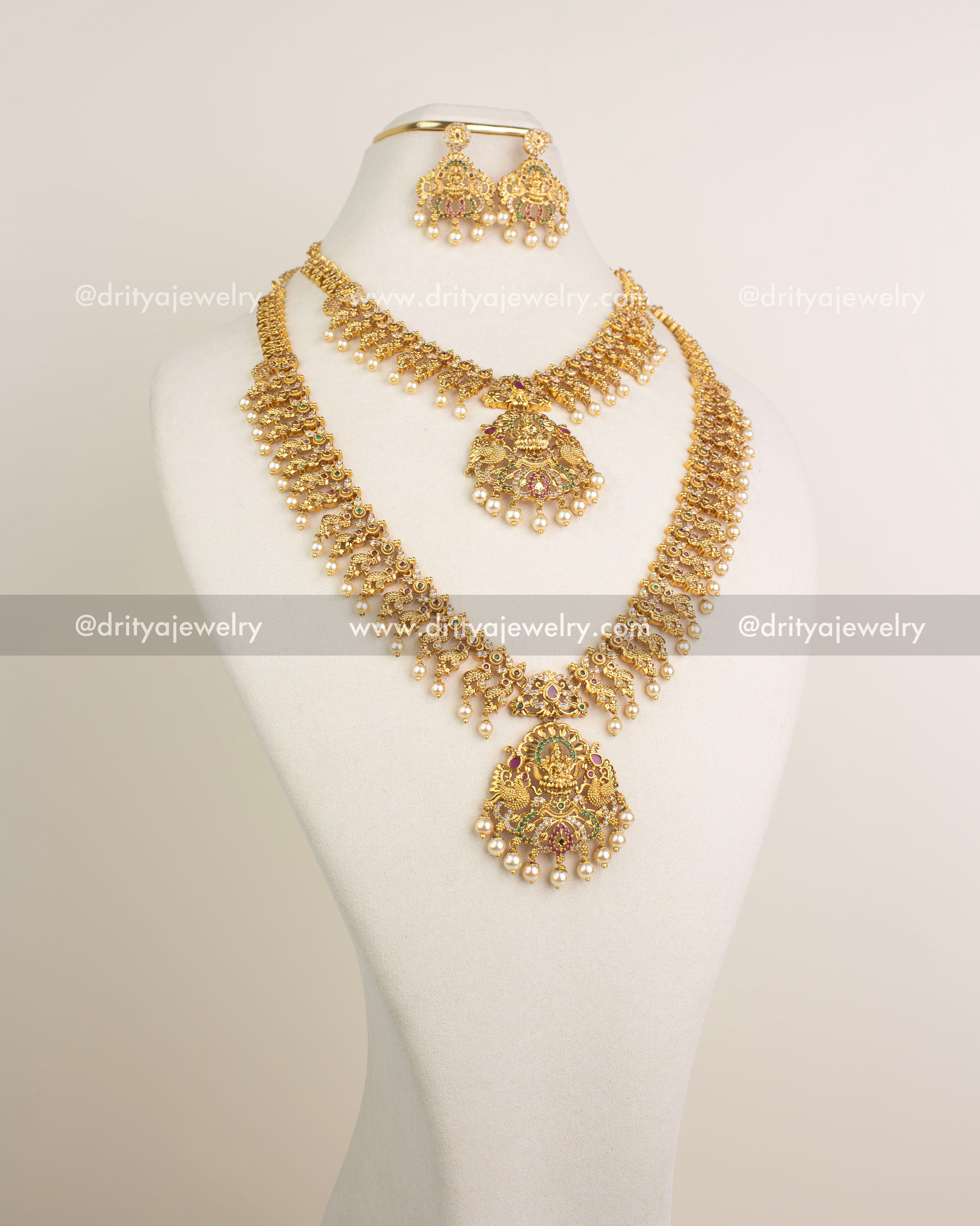 Long necklace, short necklace, earrings and maang tikka temple set in antique gold.