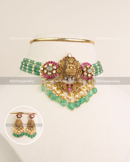 Antique gold Lakshmi Devi temple choker with matching earrings in full set view.