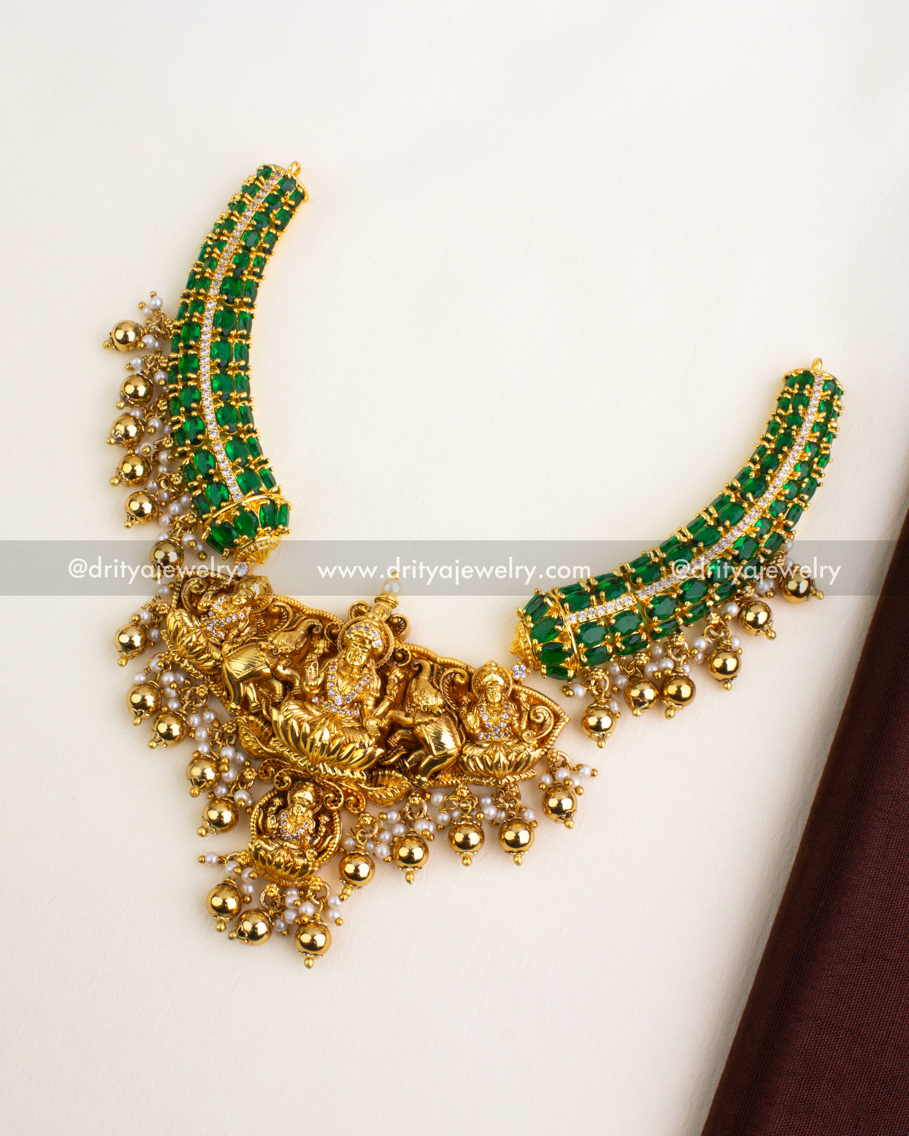Premium Nakshi short necklace with emerald green stones and Lakshmi motif