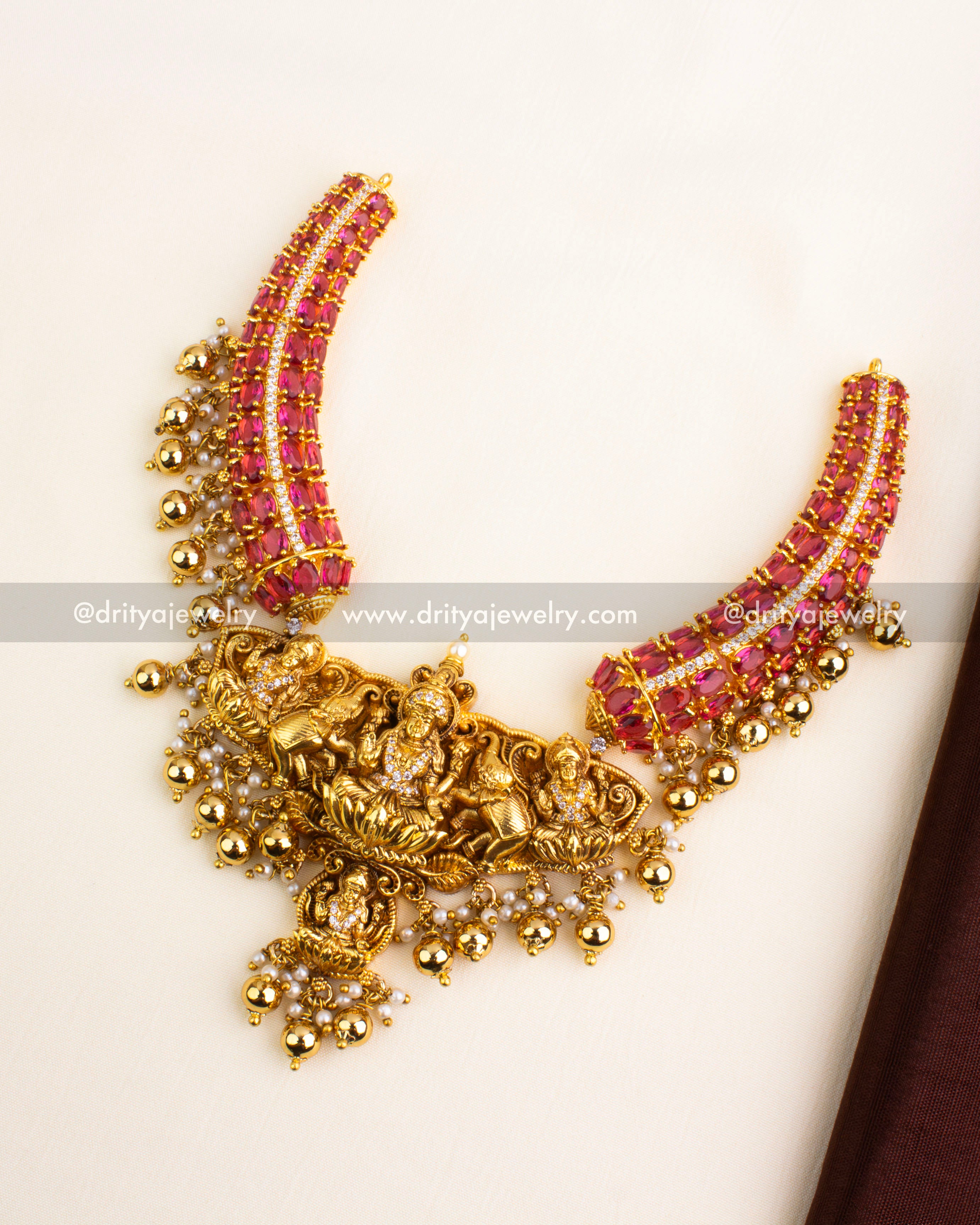 Premium Nakshi necklace in ruby red with Lakshmi center and matching earrings