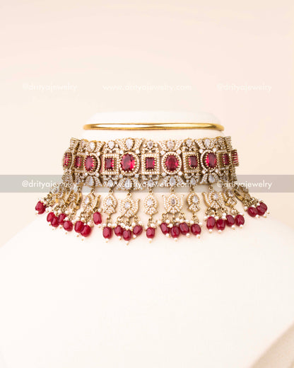 Luxurious ruby red bridal choker with AD stones and matching earrings.