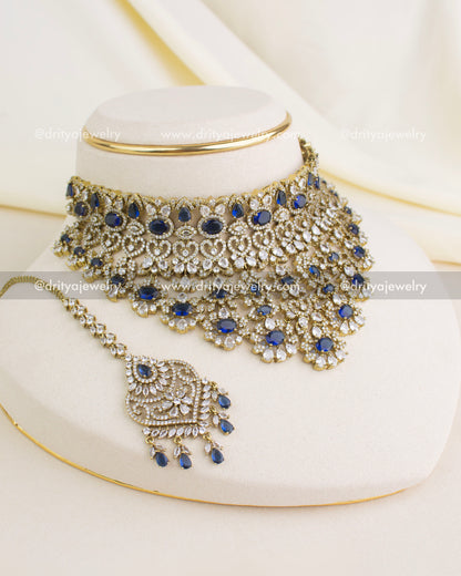 Complete sapphire blue Victorian choker set with matching big danglers and ornate maang tikka.