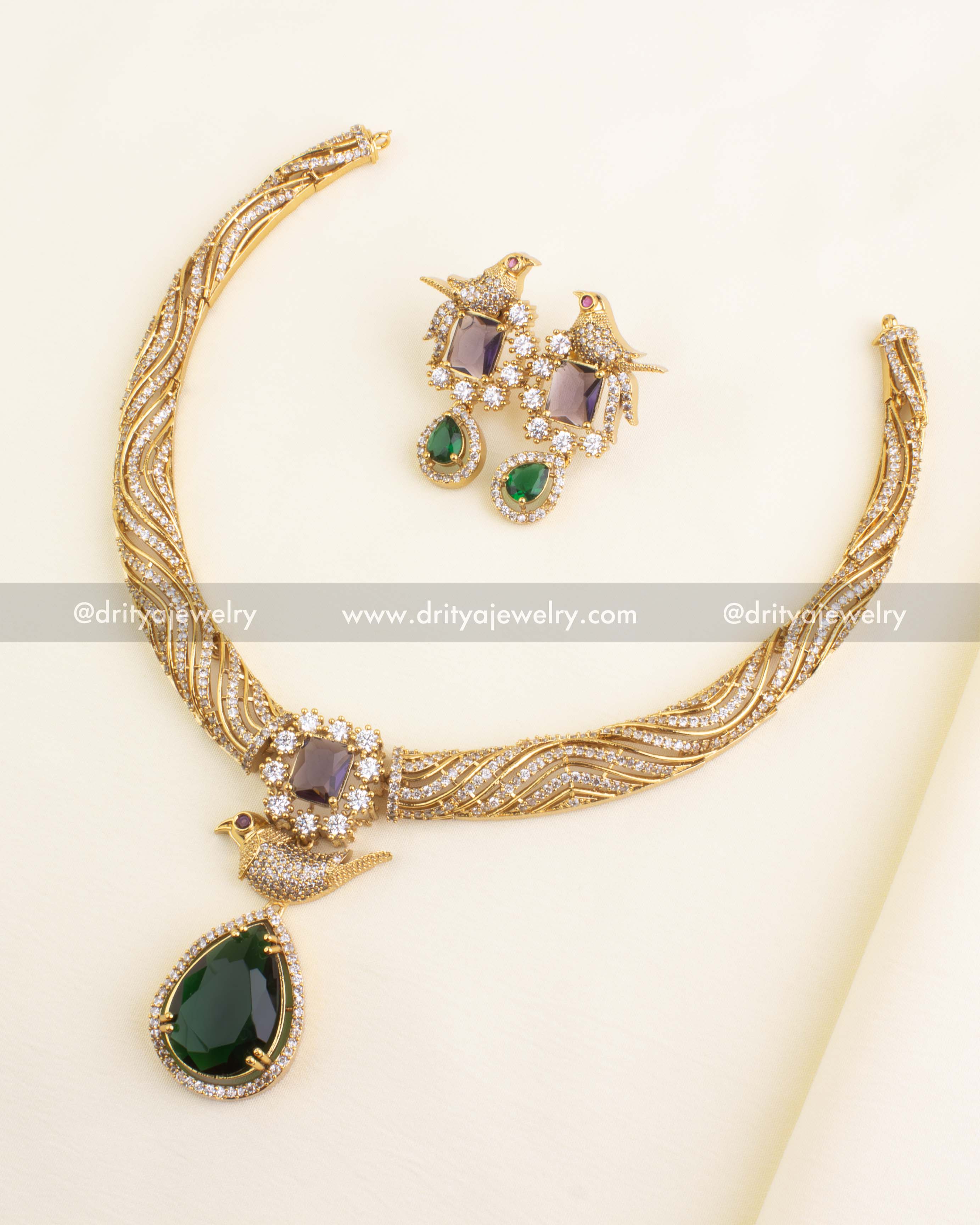 Premium CZ Kanti Style Short Necklace Set with earrings featuring bird motifs and green drop stones