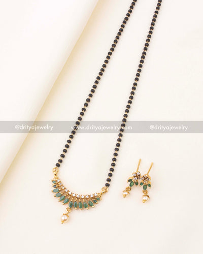 18-inch black beads necklace with green stones, CZ sparkle, and matching earrings.