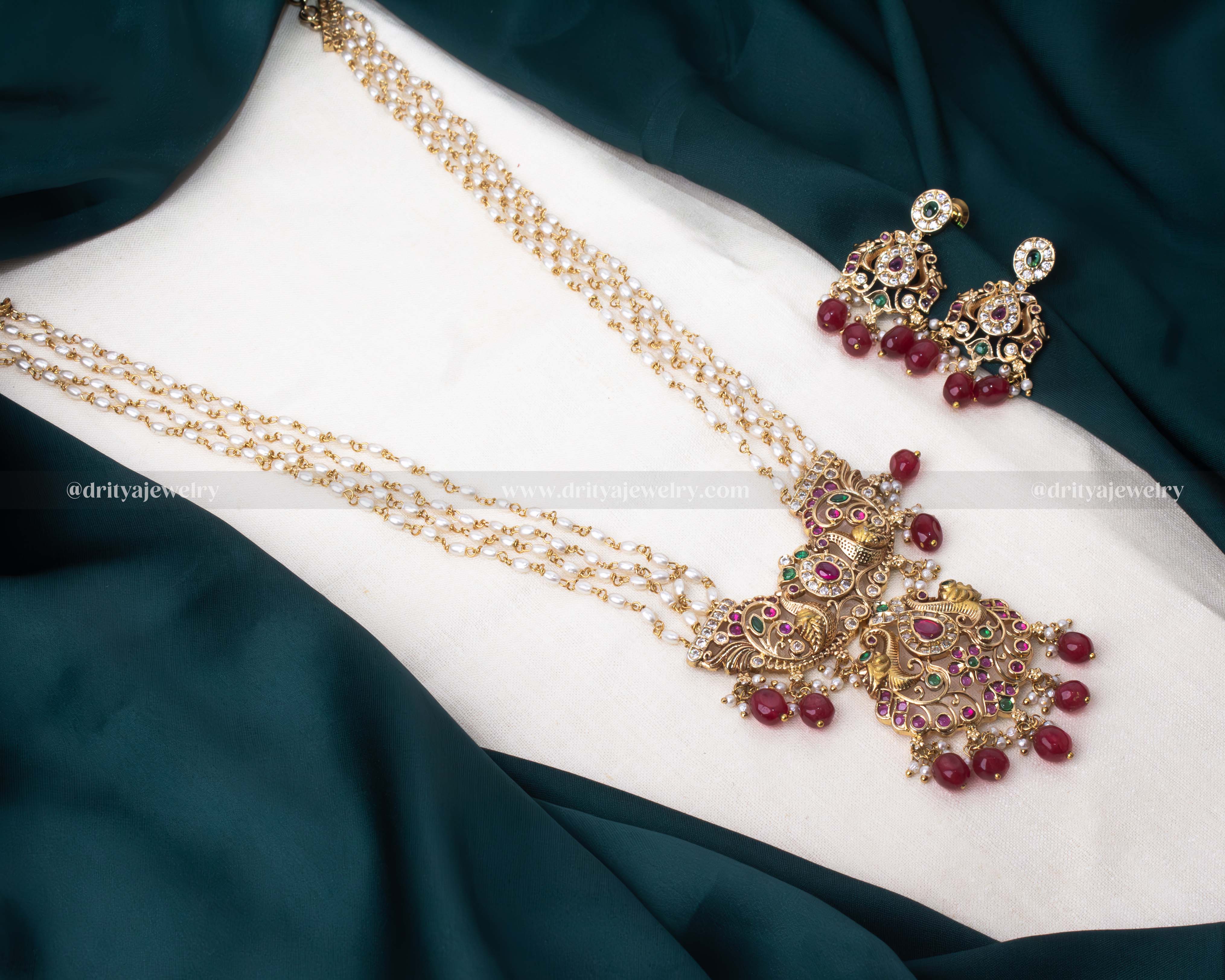 Luxurious gold-plated necklace set with rice beads and colorful gemstone accents, ideal for weddings and festive occasions.