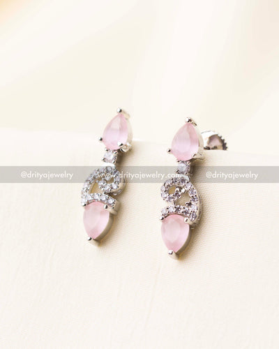 Elegant blush pink drop earrings with dual-tone stonework and silver CZ detailing.