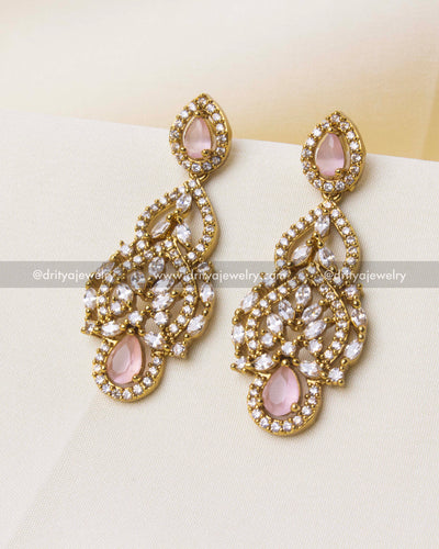 Long-drop Victorian earrings with blush pink teardrop stones and CZ accents.