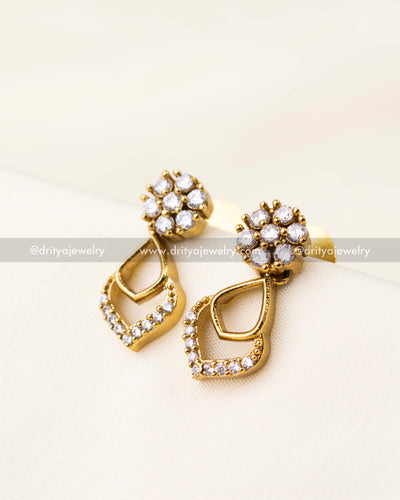 Earrings with round floral CZ tops and teardrop-shaped gold dangles