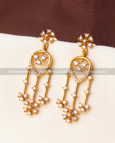 Elegant gold-plated earrings with CZ floral motifs and triple dangles