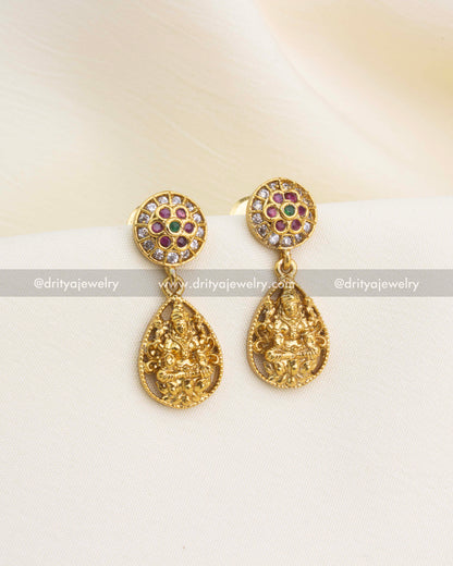 Gold-plated earrings featuring embossed Lakshmi drops and CZ floral top design.