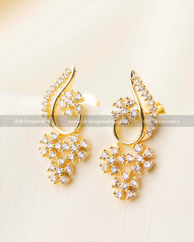 Pair of gold-plated floral CZ earrings matching short necklace design