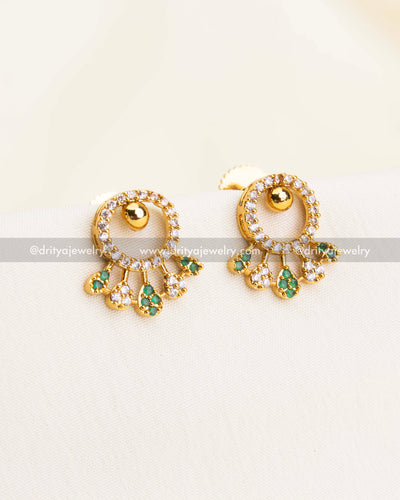 Stud earrings with gold circle design, CZ halo, and green stone danglers.