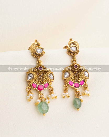 Idol-free kemp earrings with peacock motifs, polki kundan stones, pearl clusters, and green bead drops