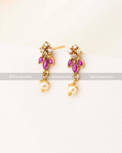 Gold-plated earrings with pink stones, CZ sparkle, and pearl danglers.