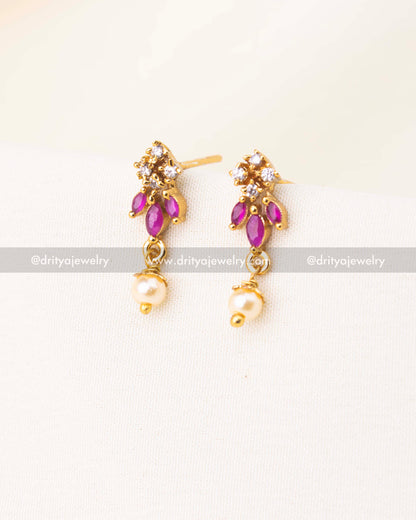 Gold-plated earrings with pink stones, CZ sparkle, and pearl danglers.