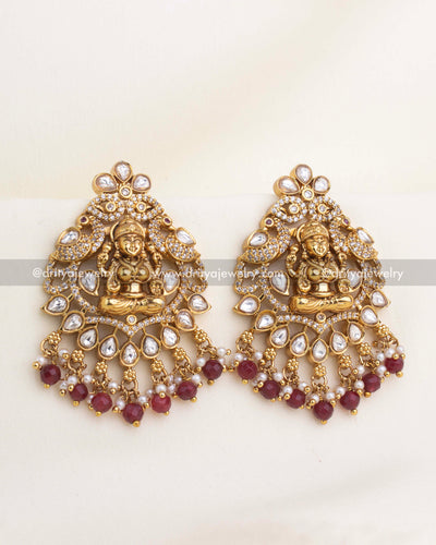 Lakshmi temple earrings with polki kundan stones, CZ highlights, and ruby bead clusters