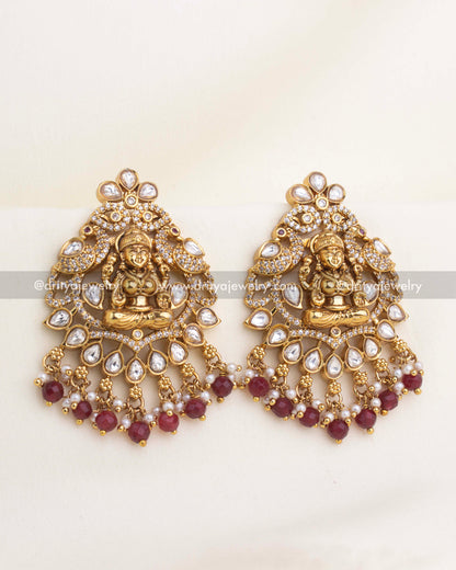 Lakshmi temple earrings with polki kundan stones, CZ highlights, and ruby bead clusters