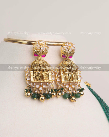 Temple-style earrings with Ram Parivar engravings, Kemp detailing, and green bead drops.