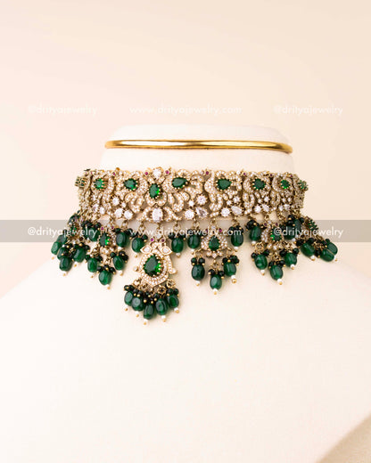 Elegant Victorian choker with green stones and bead drops displayed in side profile