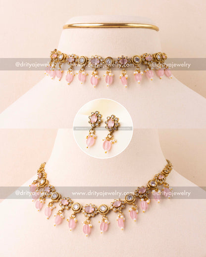 Blush pink choker necklace with AD stones and bead danglers in antique gold finish.