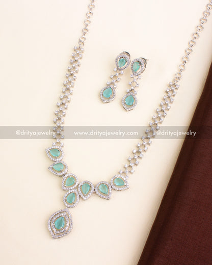 Mint green stone necklace set with AD-studded halo design and silver finish