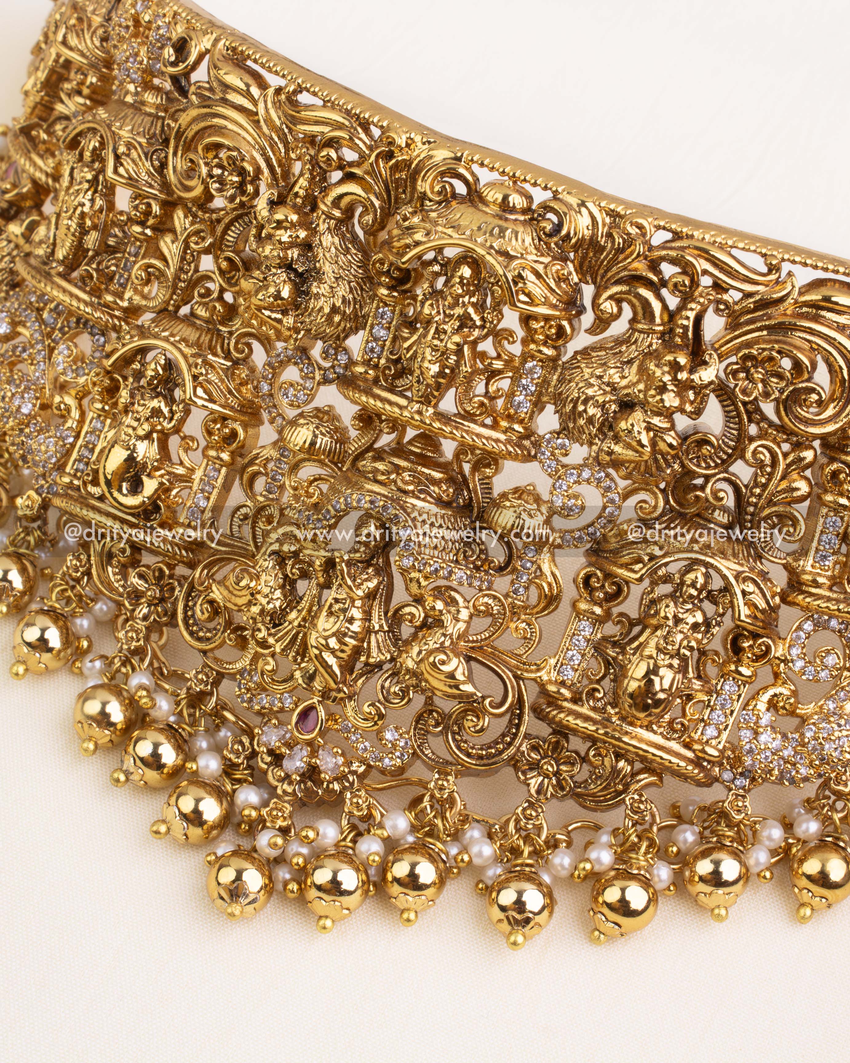 Detailed view of Nakshi choker with lion heads and Lakshmi temple carvings