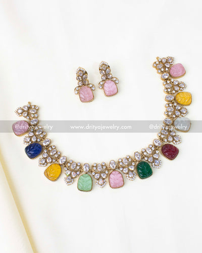 Vibrant multicolour stone necklace set with carved leaf-shaped stones and stud earrings.