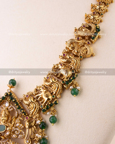 Detailed temple chain featuring elephant and peacock carvings with antique finish.