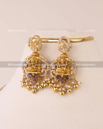 Traditional earrings featuring Lakshmi motif with CZ stones and gold bead drops.
