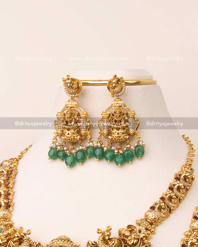 Matching nakshi Lakshmi earrings with emerald green beads and peacock stud top.