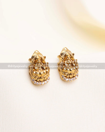 Gold-plated Nakshi studs featuring Lakshmi Devi motif and CZ stone detailing.