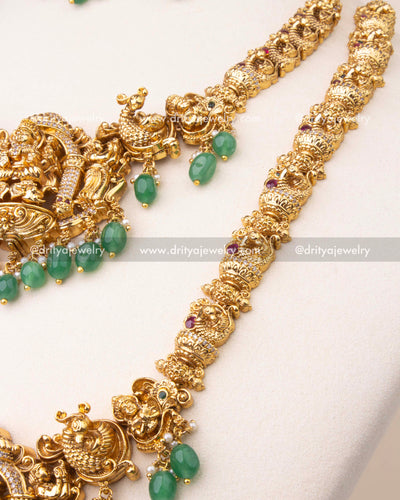 Close-up of temple-style necklace chain with yali and peacock motifs in nakshi work.